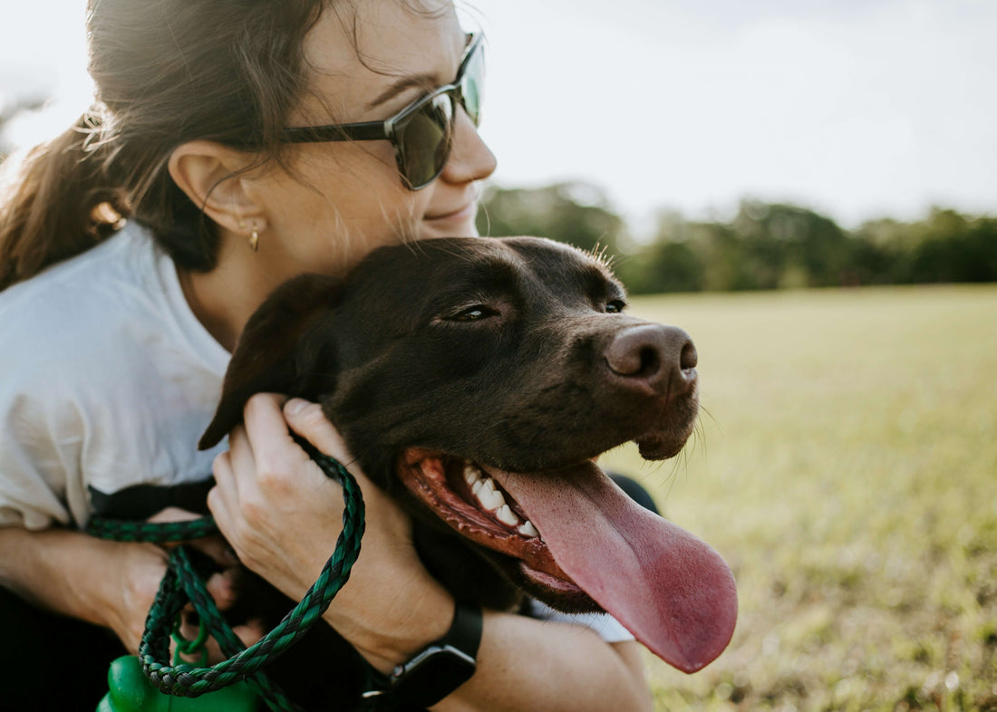 A woman holding her dog