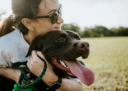 A woman holding her dog